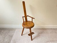 Full view of wooden tripod spinning chair