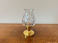 Full view of Waterford crystal hurricane candle holder showing crystal shade and brass base