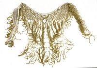 Full view of gold beaded sequin shawl laid flat