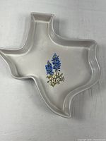 Top view of Texas-shaped dish showing bluebonnet design and glaze
