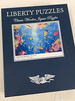 Front of box showing brand, title, artwork, dimensions and piece count