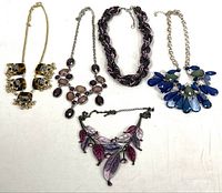 Group shot of all five necklaces spread out