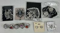 Entire lot laid out showing all twelve jewelry pieces