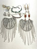 All nine jewelry pieces arranged on neutral background