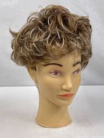 Front view of mannequin head with wig