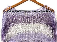 Front upper section of purple and white mesh cover-up on hanger