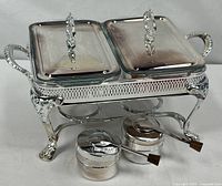 Complete buffet set assembled with stand, glass dishes, lids, and fuel holders