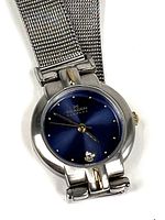 Front view of Skagen watch showing blue dial and mesh band