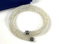 Full view of bracelet coiled in circle showing crystal fill