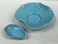 Both turquoise pottery pieces side by side