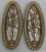 Full view of both gold plastic Syroco floral wall plaques