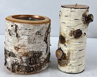Two birch-style candles side by side