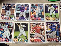 Eight 2023 Topps rookie cards laid out; six identified for lot