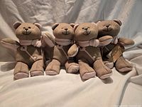 Group shot of four Starbucks Bearista Bear plush toys