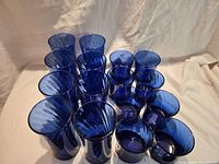 Top view showing all 16 cobalt blue glasses grouped together