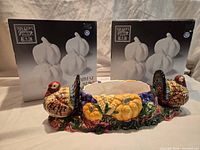 Turkey dish in front, two boxes of Harvest S&P shakers displayed behind