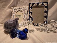Group shot of all items including frames, glass birds, swans, chicken