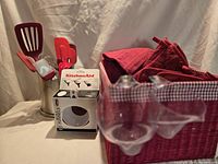Overview showing utensil holder, boxed funnels and red basket