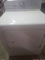 Front view of white Maytag electric dryer