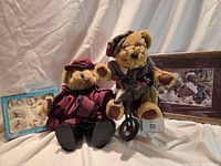Overall lot showing two dressed teddy bears, boxed tea set and framed print