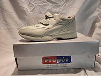 Side view of left shoe on box