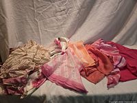 All seven scarves arranged showing colors and patterns