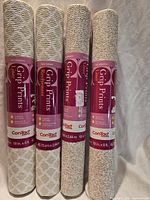 Four sealed rolls of Con-Tact Grip Prints shelf liner with labels visible