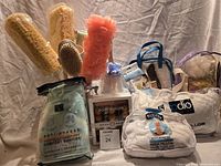 Full lot overview showing all packaged spa and comfort items