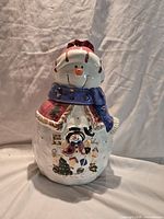 Front view of ceramic snowman cookie jar showing full design