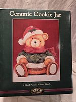 Product box front showing image of teddy bear cookie jar and branding