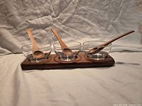 Full set showing teak tray, three glass bowls, three wooden spoons