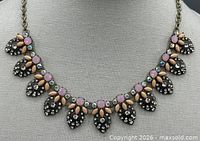 Front view of full necklace on display form