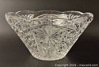 Side view of cut crystal bowl showing starburst pattern and scalloped rim