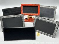 Front view of five chalkboard stands showing material and finish