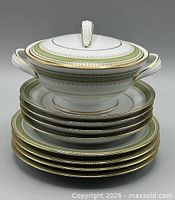 Stacked plates with lidded sugar bowl showing pattern and trim