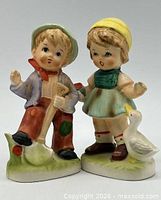 Front view of both ceramic figurines