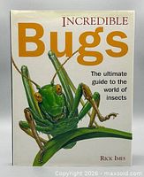 Front cover of book showing title and grasshopper artwork