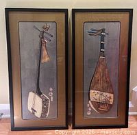 Front view of both framed prints showing shamisen and biwa artworks