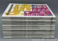 Spine view of all 13 matching hardcovers showing titles and volume numbers