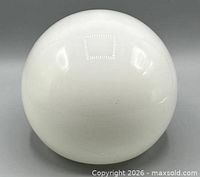 Front view of spherical white glass shade