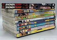 Stack of ten Shonen Jump magazines showing spines with 2008 and 2011 dates