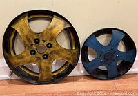Front view of both metal wheel rims showing colors and size difference
