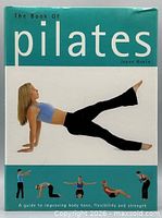Front cover of The Book of Pilates hardcover