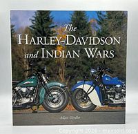 Front cover of book showing title and motorcycles