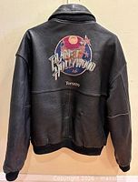 Back view leather side showing large embroidered Planet Hollywood Toronto logo