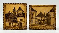 Front view both square wood plaques showing etched town scenes