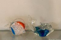 Fish and dolphin figurines front view