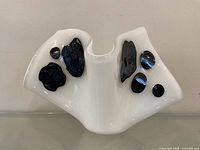 Front view showing folded shape and dark glass patches