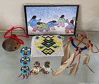 Full lot overview showing print, beaded pouch, whistle, dreamcatcher, blue rosettes, earrings