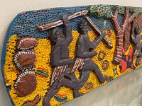 Left section showing two figures with tools, textured yellow background